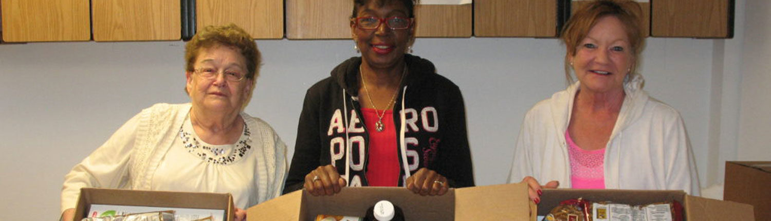 Members Packing Boxes of Food