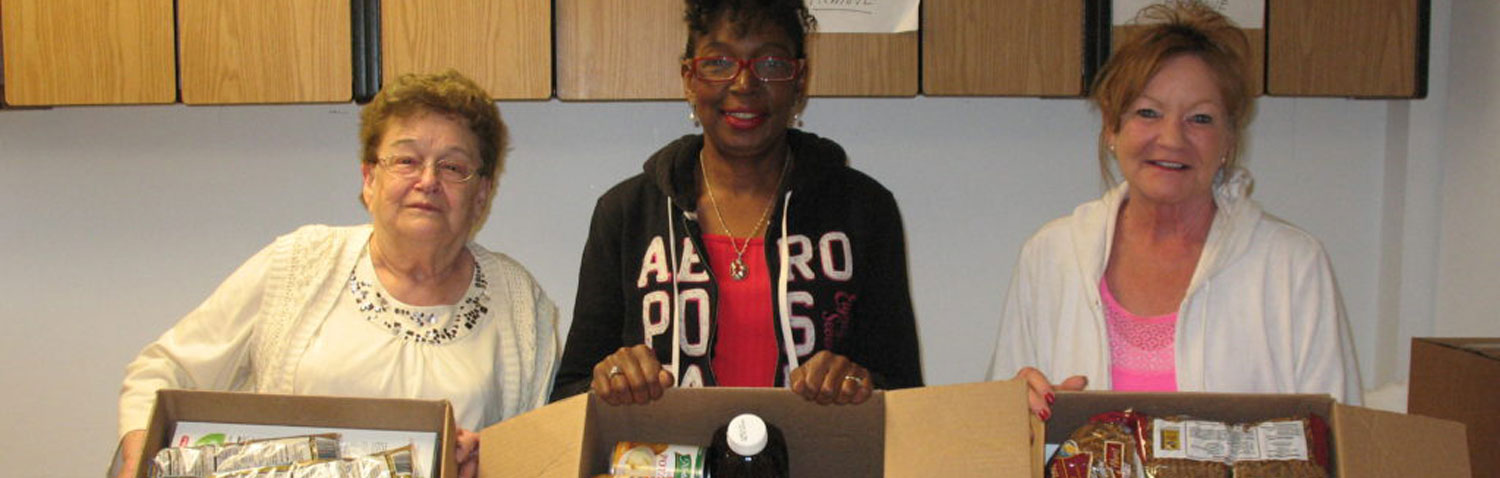 Members Packing Boxes of Food